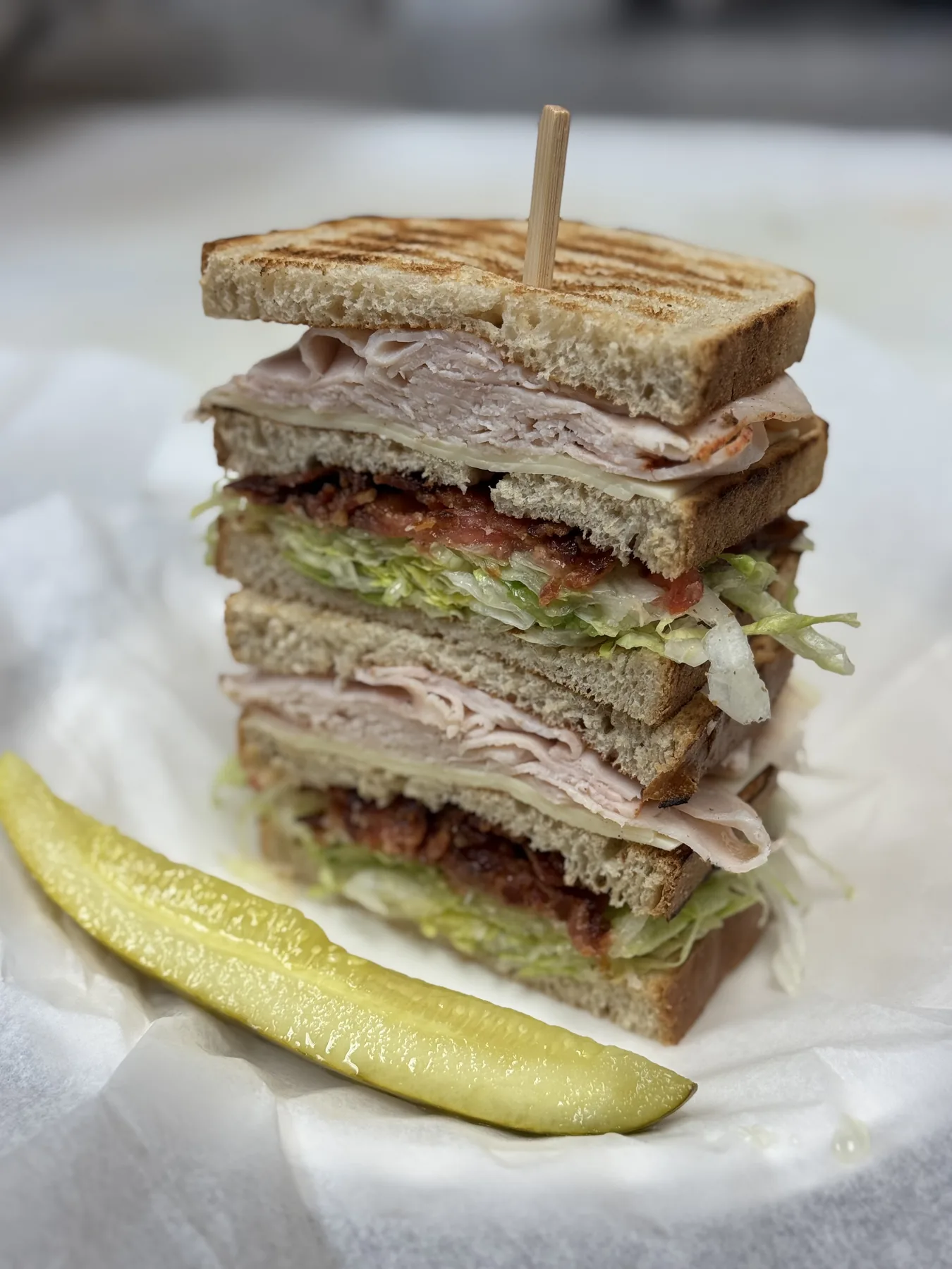 Club sandwich stack with pickle from Windsor Deli